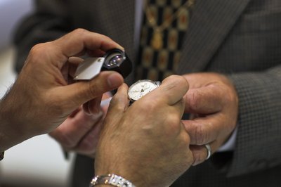 Rolex watch being examined