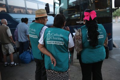 Three representatives from Catholic Charities
