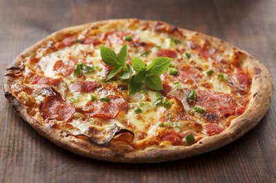 Fresh basil adds a delectible herbiness to pizza.