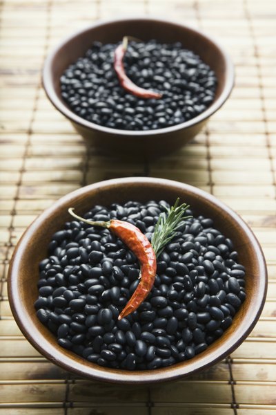 Bowl of black beans with chili pepper
