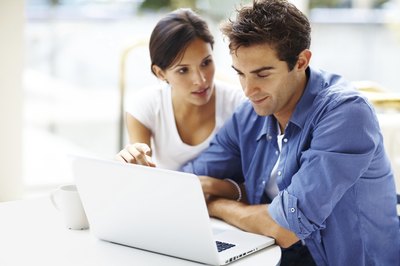 Couple working on business plan