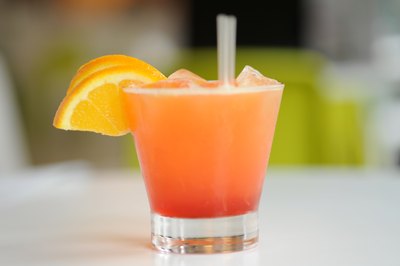 A refreshing Black-Eyed Susan cocktail garnished with an orange slice.