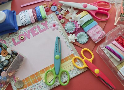 Materials and supplies to make a scrapbook.