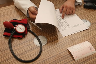 Doctor showing patient high blood pressure / hypertension results