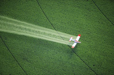 Crop duster over field