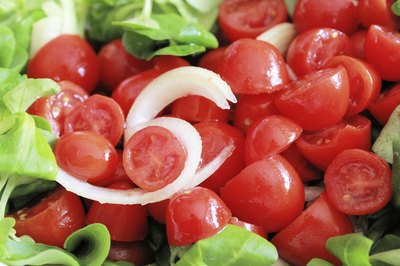 Sliced lettuce, tomato and onions