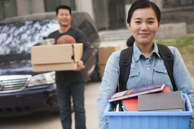 young college student moving into dorm