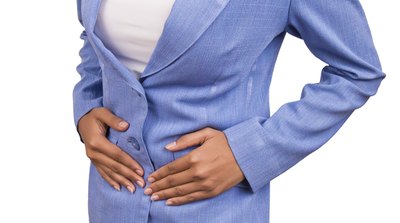 Woman with hands on her stomach