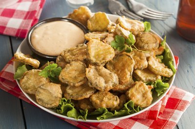 A simple fry sauce provides a cool complement to crispy fried pickles.