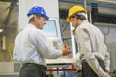 Two men working in manufacturing plant