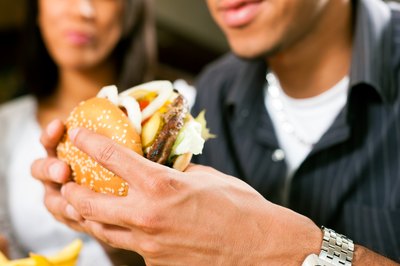 Purchase some of the menu items at each burger restaurant you visit