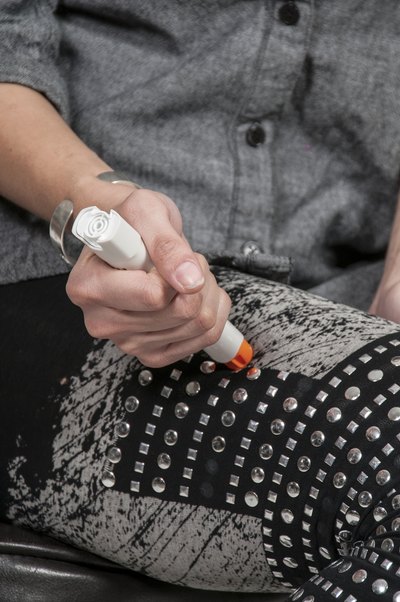 woman using an epi pen