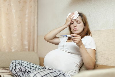 Pregnant women experience hormonal changes that may lead to flu symptoms such as nausea, vomiting or stuffy nose.