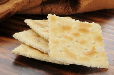 Saltine crackers on table.