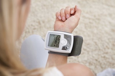 Woman checking heart rate on monitor
