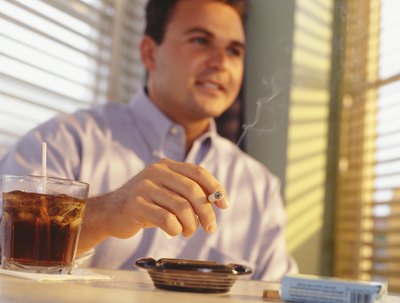 Man smoking and drinking