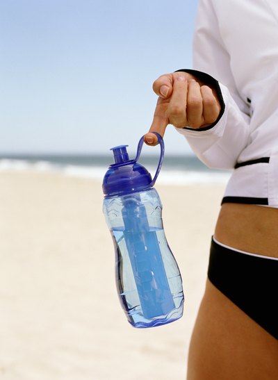 Woman holding bottle of water