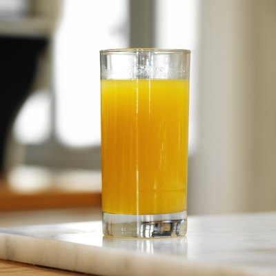 A glass of orange juice.