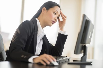 A woman feeling fatigue at work