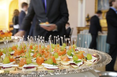 An appetizer tray in a banquet room at a business conference.