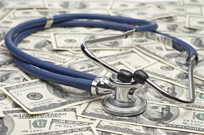 Stethoscope on money.