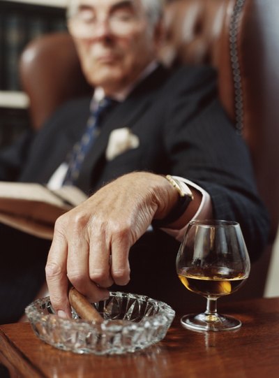 man ashing cigar