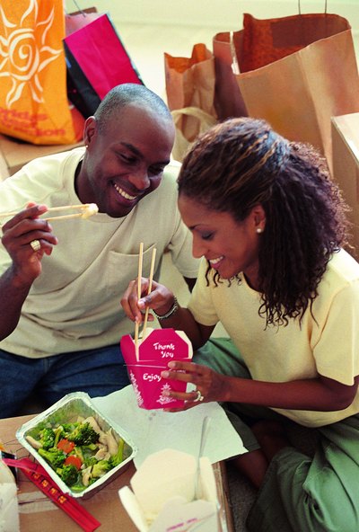 Couple eating Chinese food take out