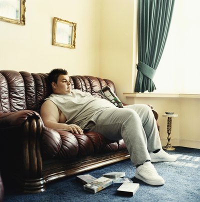 Overweight man watching television