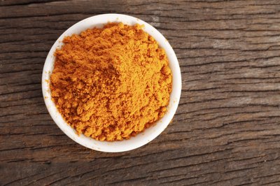 A bowl filled with turmeric powder