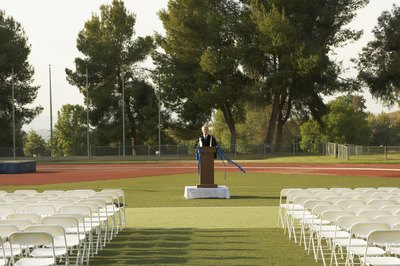 A speaker practices at the podium before an event.