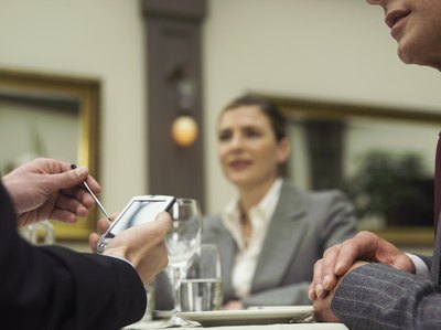 A Professional organizer meets with clients to work on getting their business started.