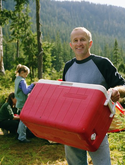 Man holding picnic cooler