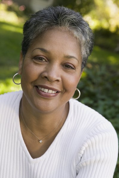 Smiling African-American woman outdoors.