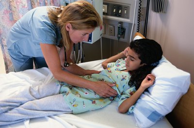 Nurse attending to patient in hosptial