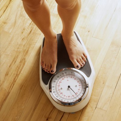 Woman on a bathroon scale