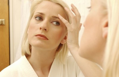 Woman looking in mirror