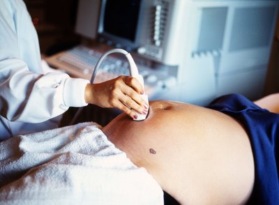 Pregnant woman having ultrasound done