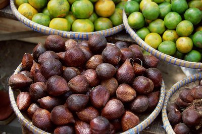 A basket of figs on display at a market.