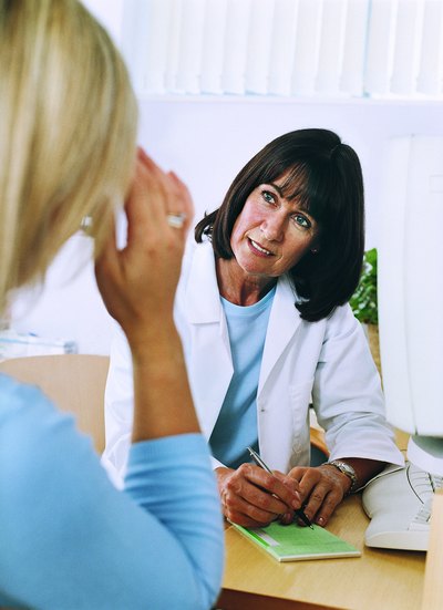 Woman meeting with her doctor