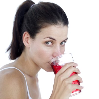 Woman drinking cranberry juice