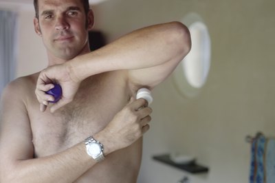 Man applying deodorant
