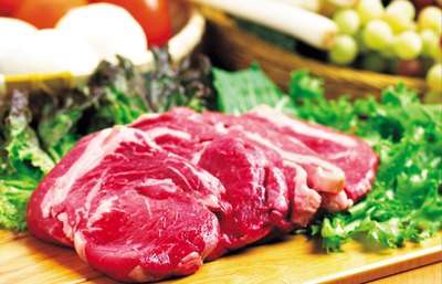 A steak is prepared for cooking.