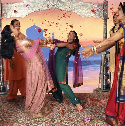 A Bollywood party is filled with an array of bright colors.