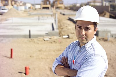 A portrait of a general contractor on a construction site.