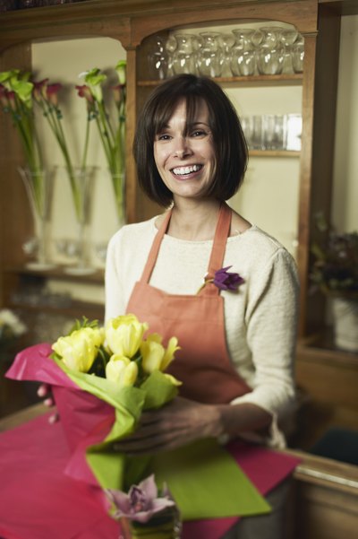 Woman arranging flowers