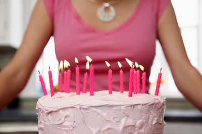 Add feminine touches to the cake like pink frosting.