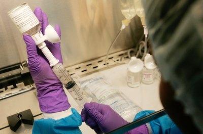 Chemotherapy medication being mixed by pharmacist