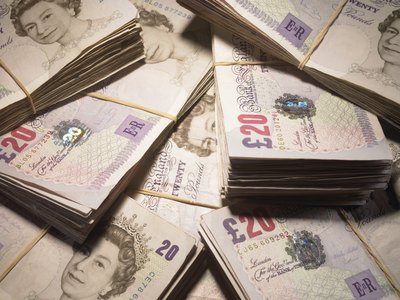 A stack of U.K. Pound notes.