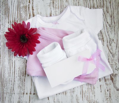 A godparent traditionally gives a new christened or baptized baby a gift as well as making a toast