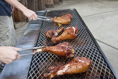 Turkey legs on the barbeque.